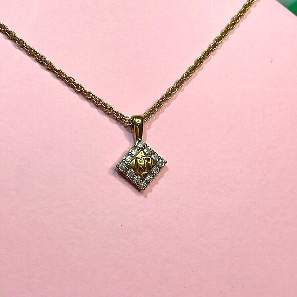 Nina Ricci Necklace 1/2 in Pendant on a 14 in Chain Gold tone Chain - Picture 1 of 4